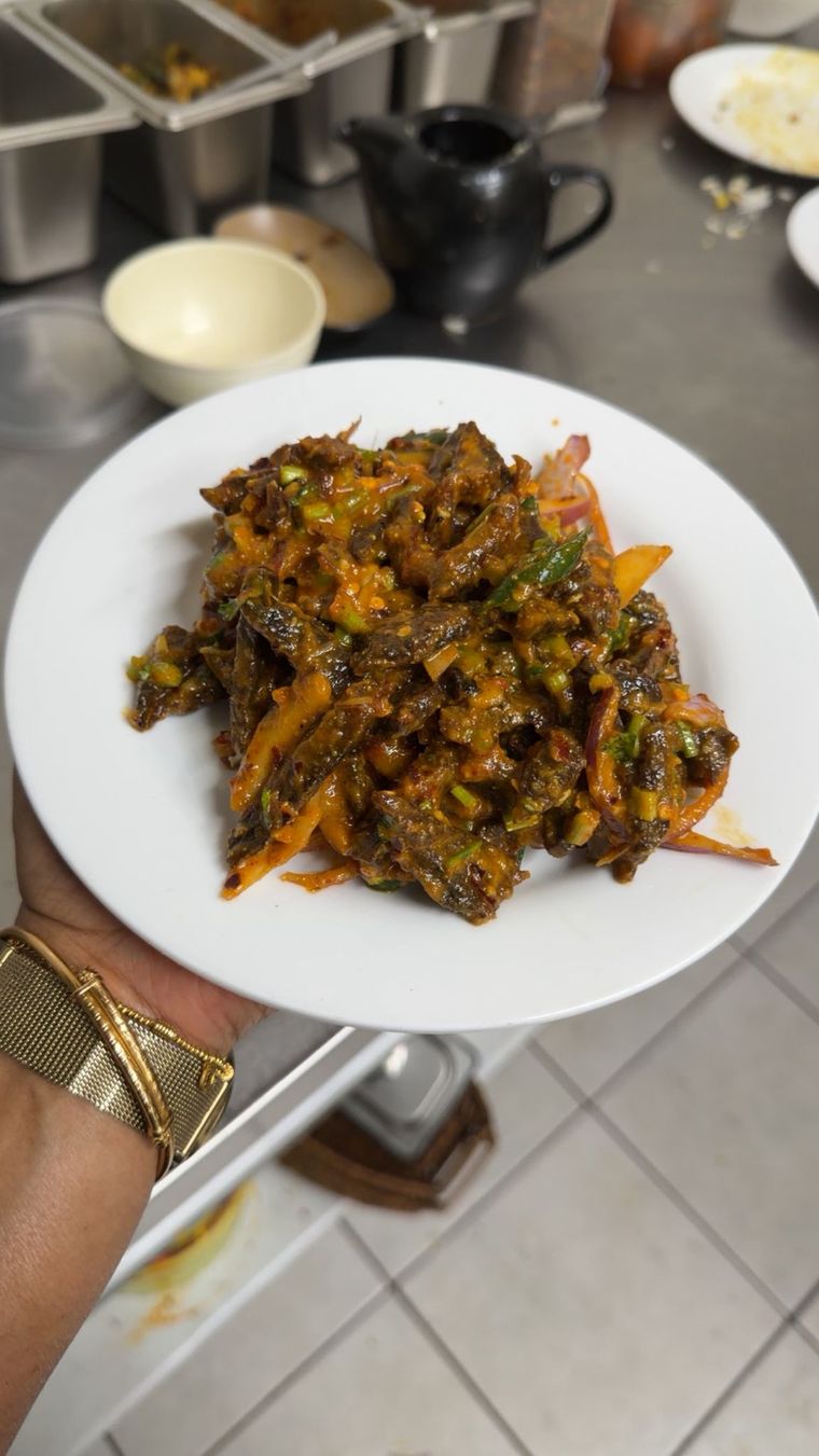 Plate of buff sukuti tossed with onion, chilli and herbs