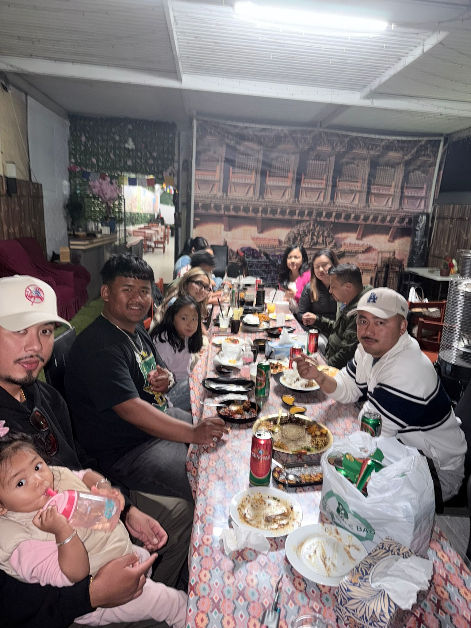 Family and friends sharing a meal together at Momo's Hunt